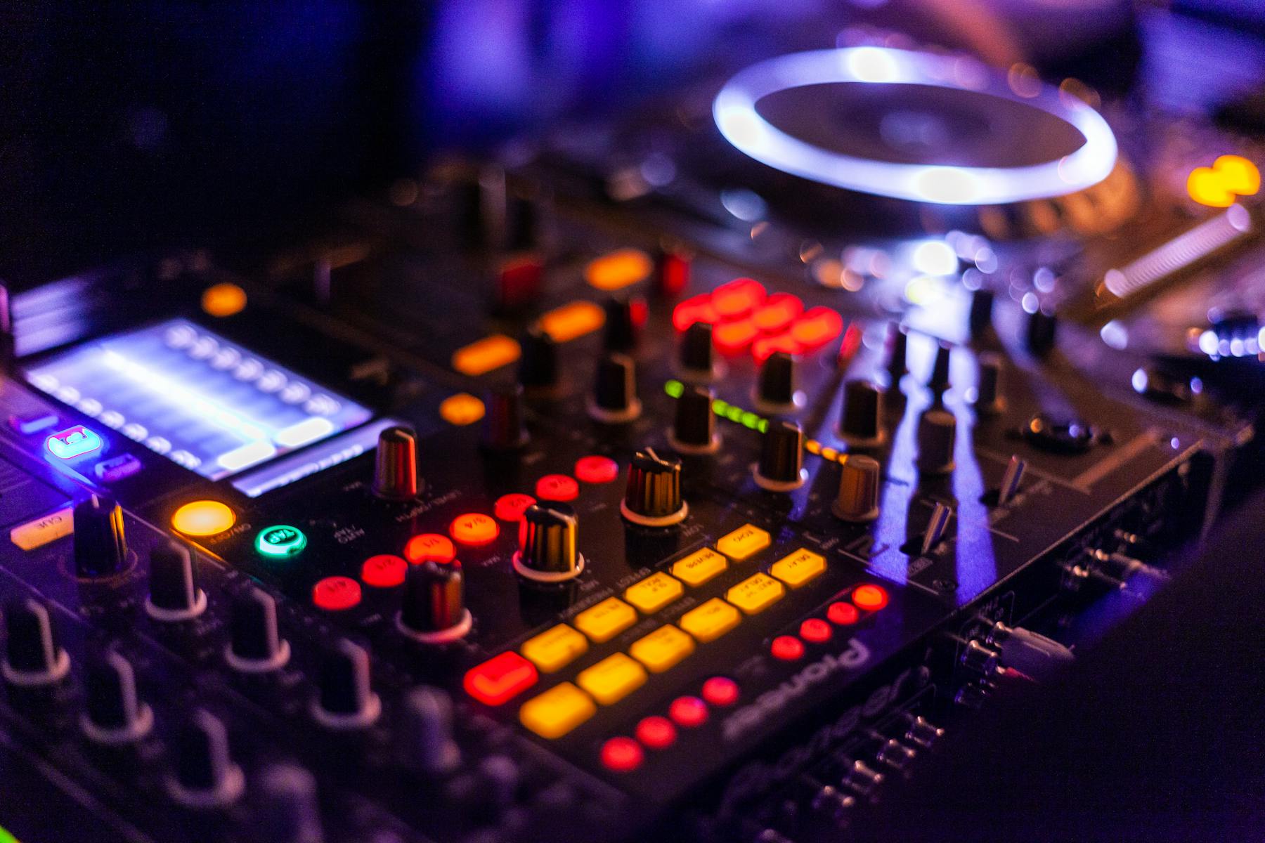 Professional DJ booth with club lighting