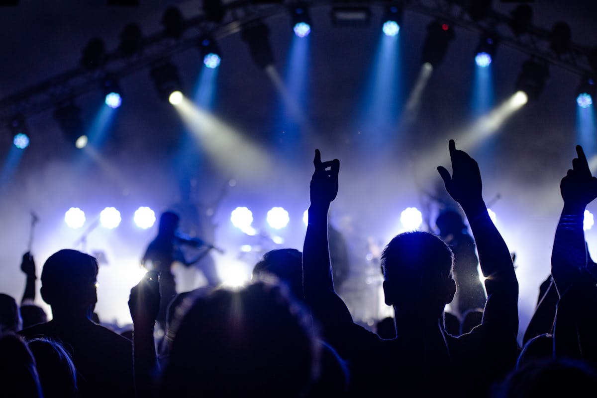 Stage lighting over a live music venue